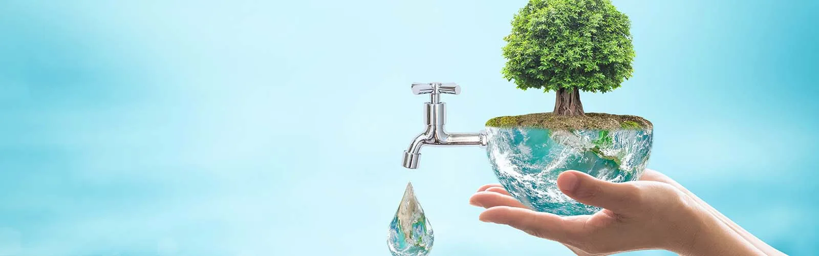 A tap of water with a drop with a hand underneath with a tree on top