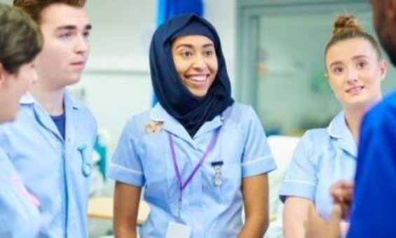 Nursing students taking in a group