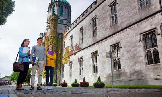 Three students in front of Quad