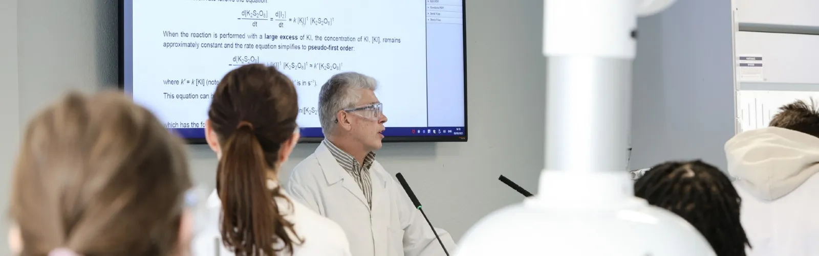 Professor teaching students
