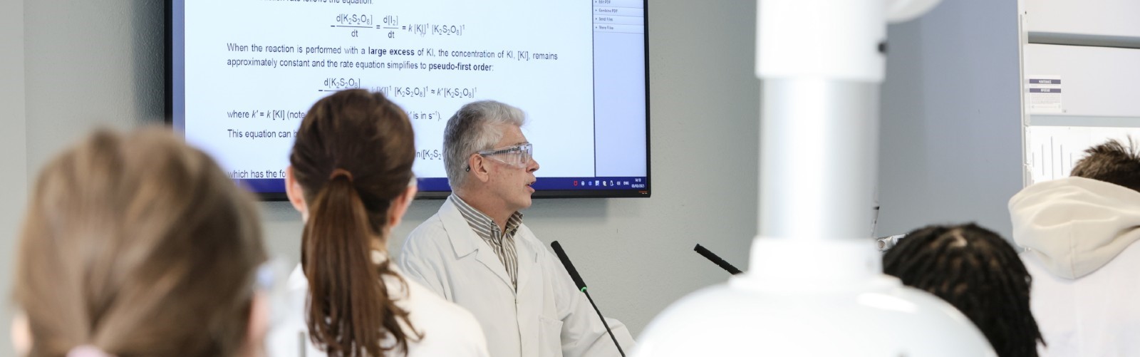 Professor teaching students