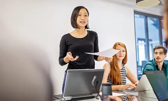 women standing up giving a presentation